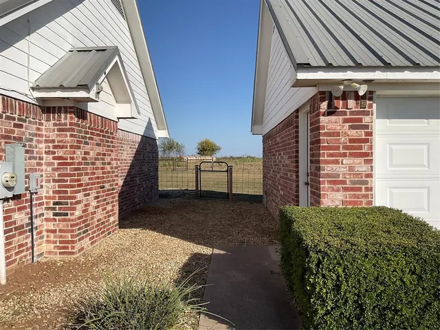 a view of backyard with cabin