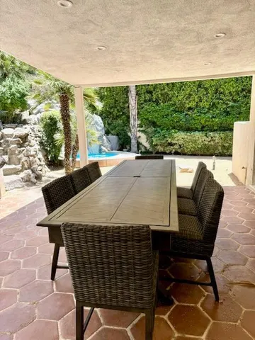 a front view of a house with a glass door