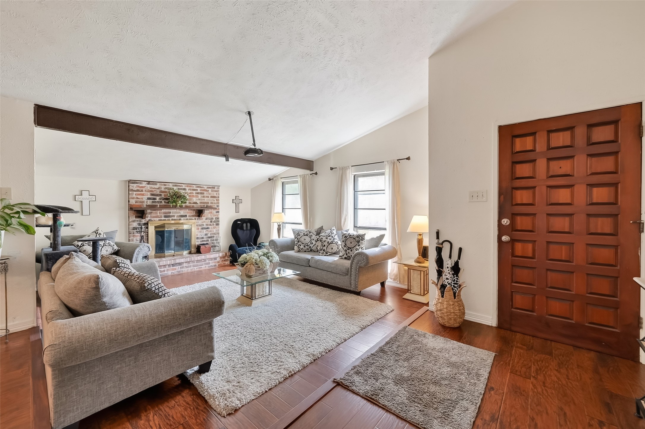 a living room with furniture and a fireplace