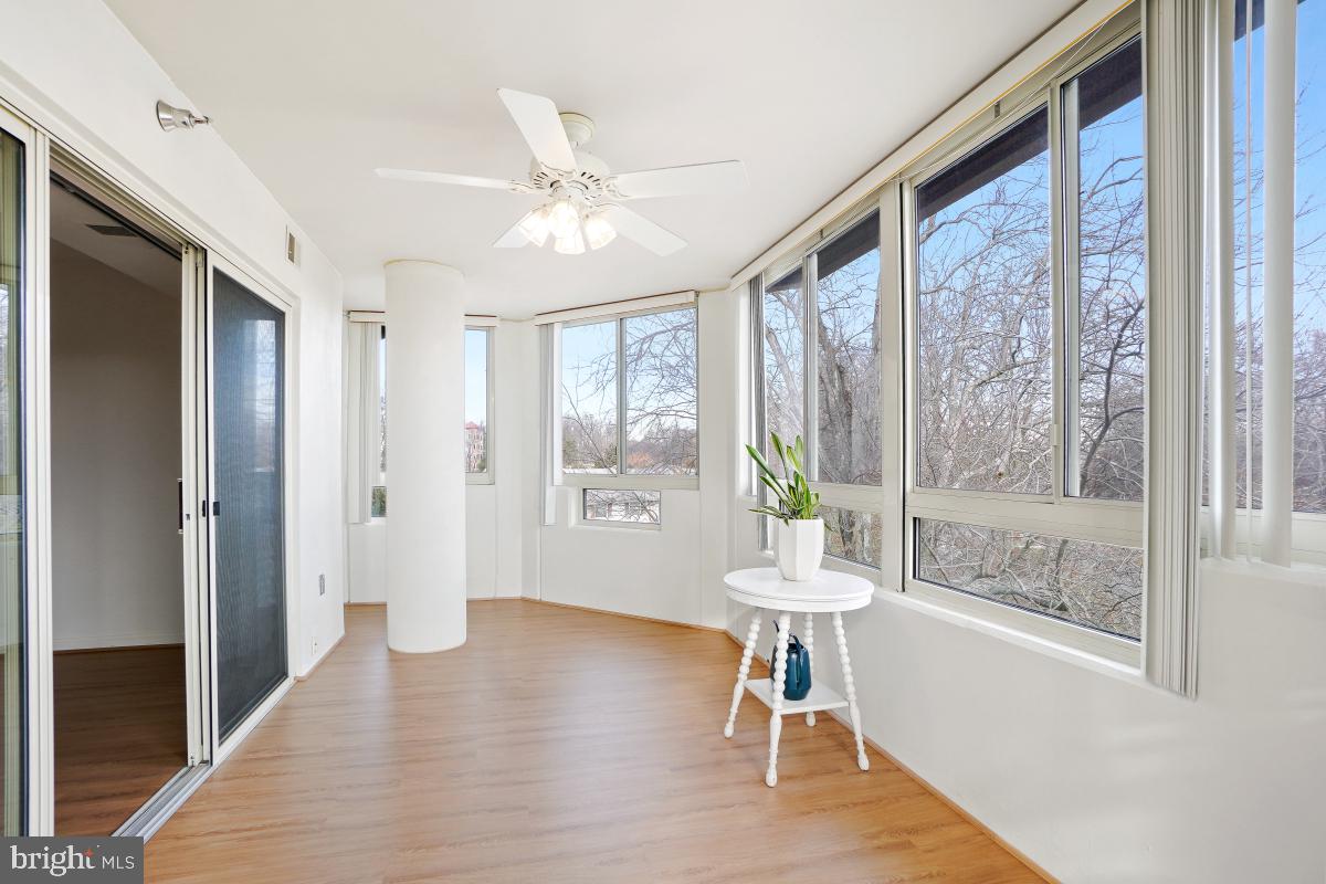 14801 Pennfield Circle, Unit 401 Silver Spring, MD 20906 - Photo 10 of 31 a view of an entryway with wooden floor and a livingroom