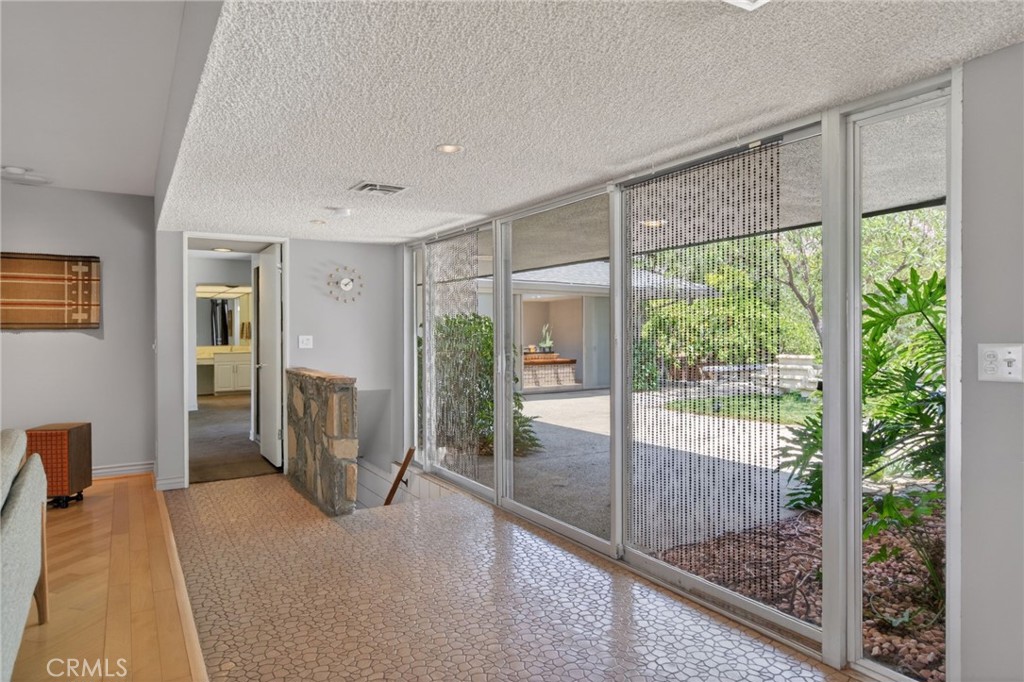 11517 Tulane Avenue Riverside, CA 92507 - Photo 24 of 75 Heading into Master wing and stairway leading to rumpus room
