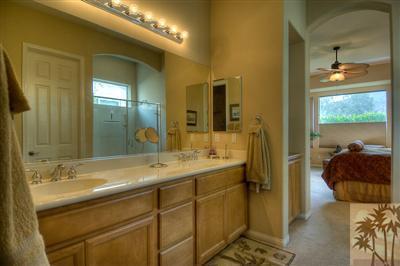 81249 Red Rock Road La Quinta, CA 92253 - Photo 22 of 25 a en suite bathroom with a sink and a mirror