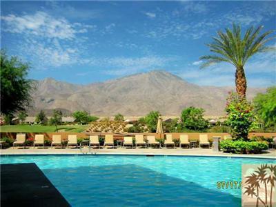 81249 Red Rock Road La Quinta, CA 92253 - Photo 25 of 25 a front view of a house with a garden and lake view
