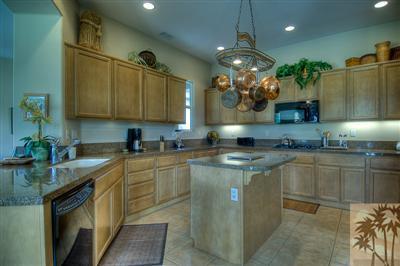 81249 Red Rock Road La Quinta, CA 92253 - Photo 6 of 25 a kitchen with sink cabinets and window