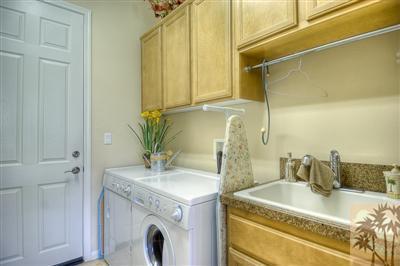 81249 Red Rock Road La Quinta, CA 92253 - Photo 9 of 25 a bathroom with a granite countertop sink and a mirror