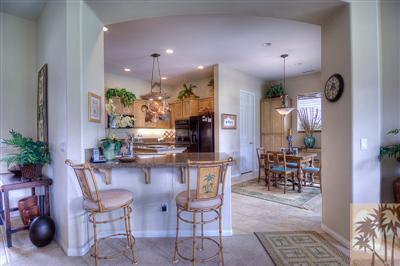 81249 Red Rock Road La Quinta, CA 92253 - Photo 10 of 25 a kitchen with a table and chairs in it