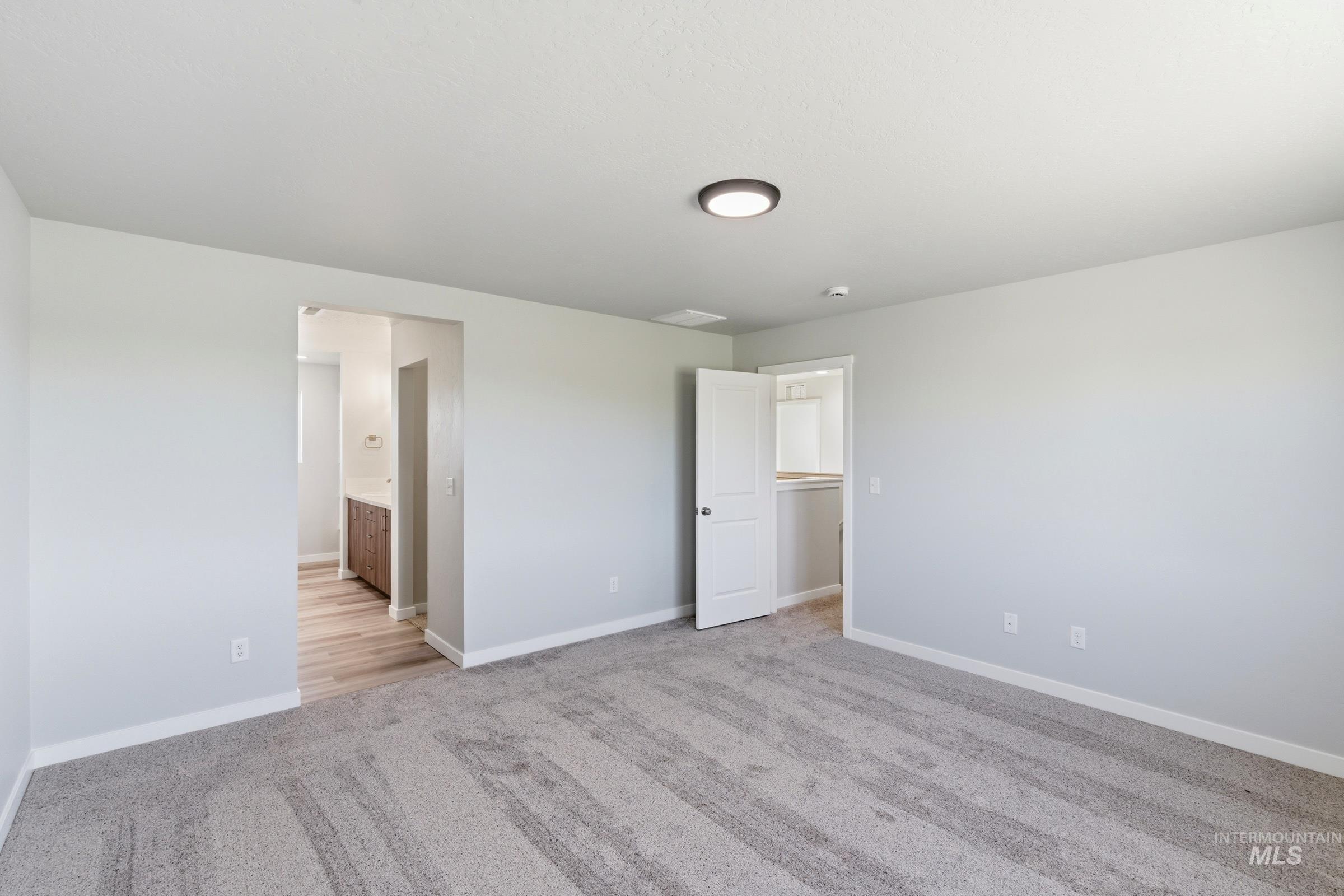 13709 Redway Court Caldwell, ID 83607 - Photo 28 of 28 Spacious room with light gray wall paint and white baseboards