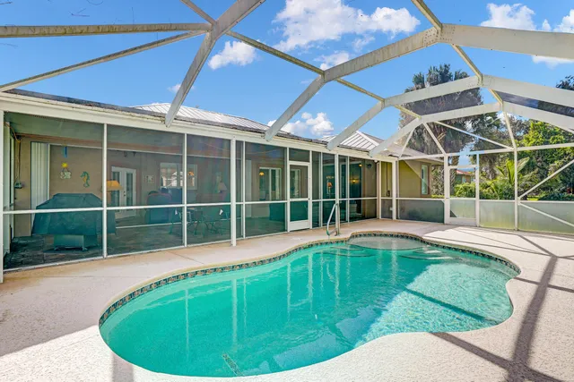 a view of a house with a backyard and a window