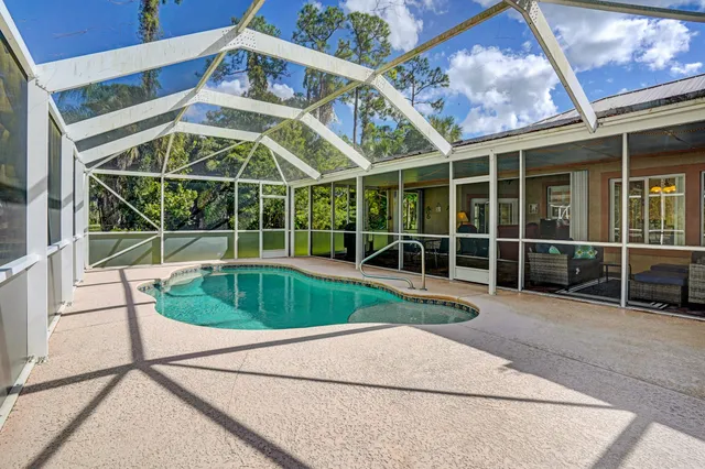 a utility room with cabinets washer and dryer