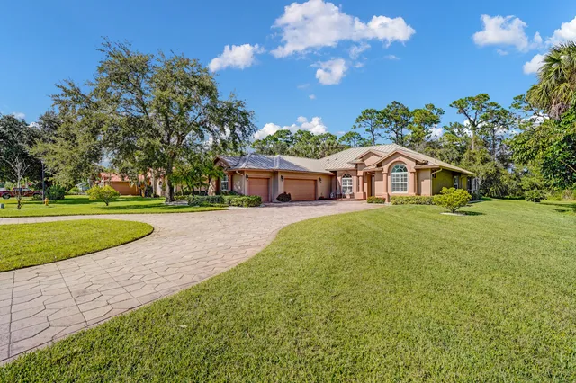 a view of a house with a big yard