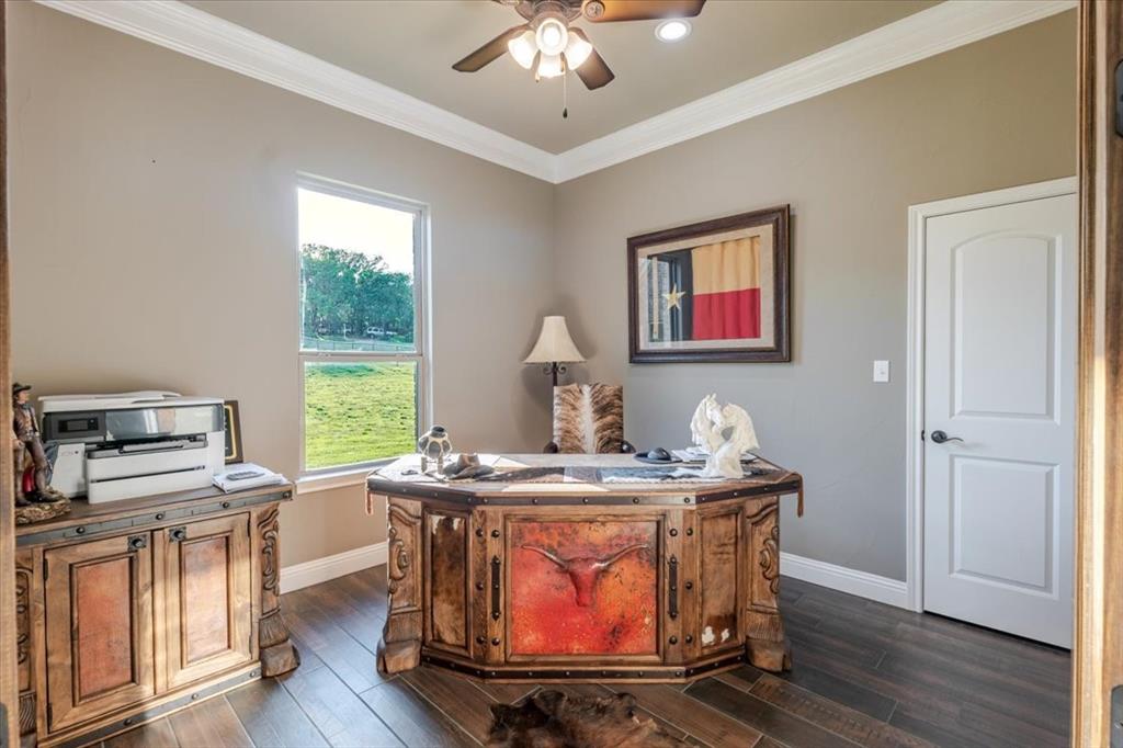 10106 Prather Road Springtown, TX 76082 - Photo 17 of 40 a room with furniture and wooden floor