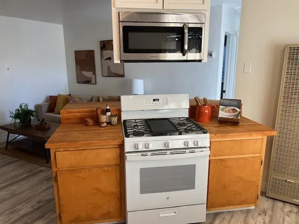 a kitchen with a stove and a microwave