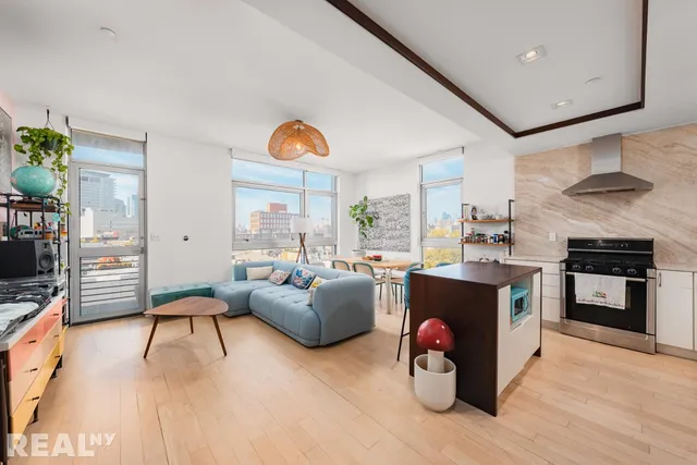 a picture of a room with a white bed and a white cabinet