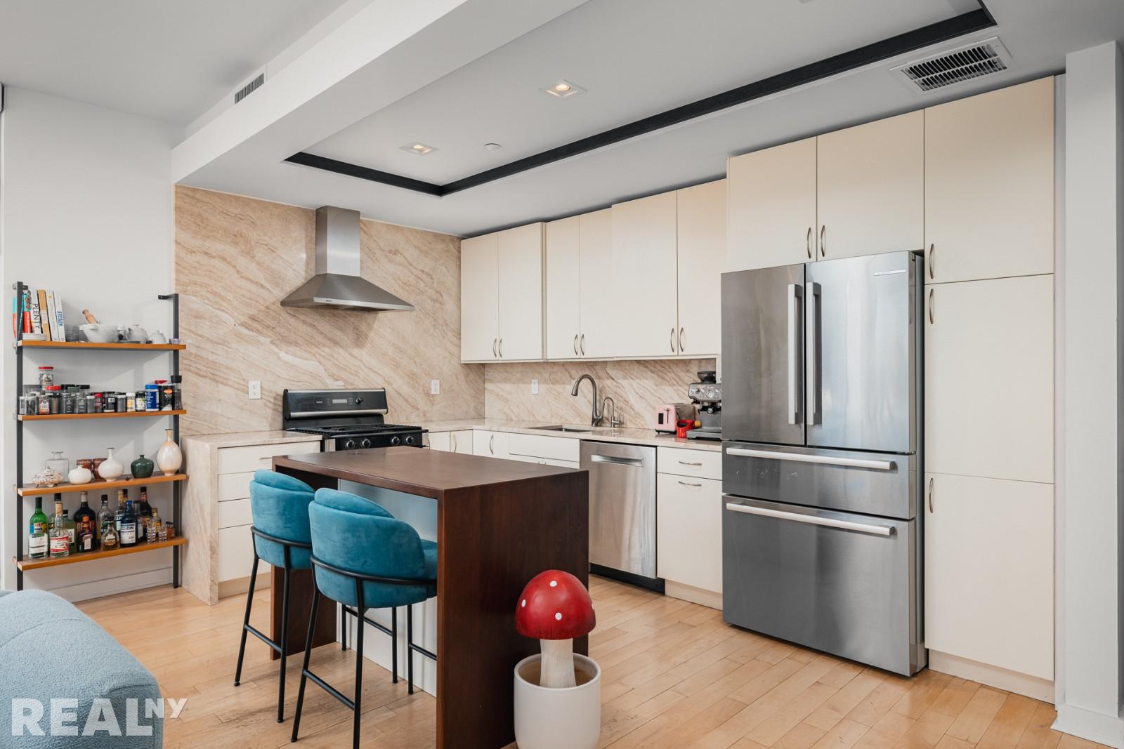 82 Guernsey Street, Unit PH5 Brooklyn, NY 11222 - Photo 2 of 10 a kitchen with stainless steel appliances a refrigerator sink and wooden floor