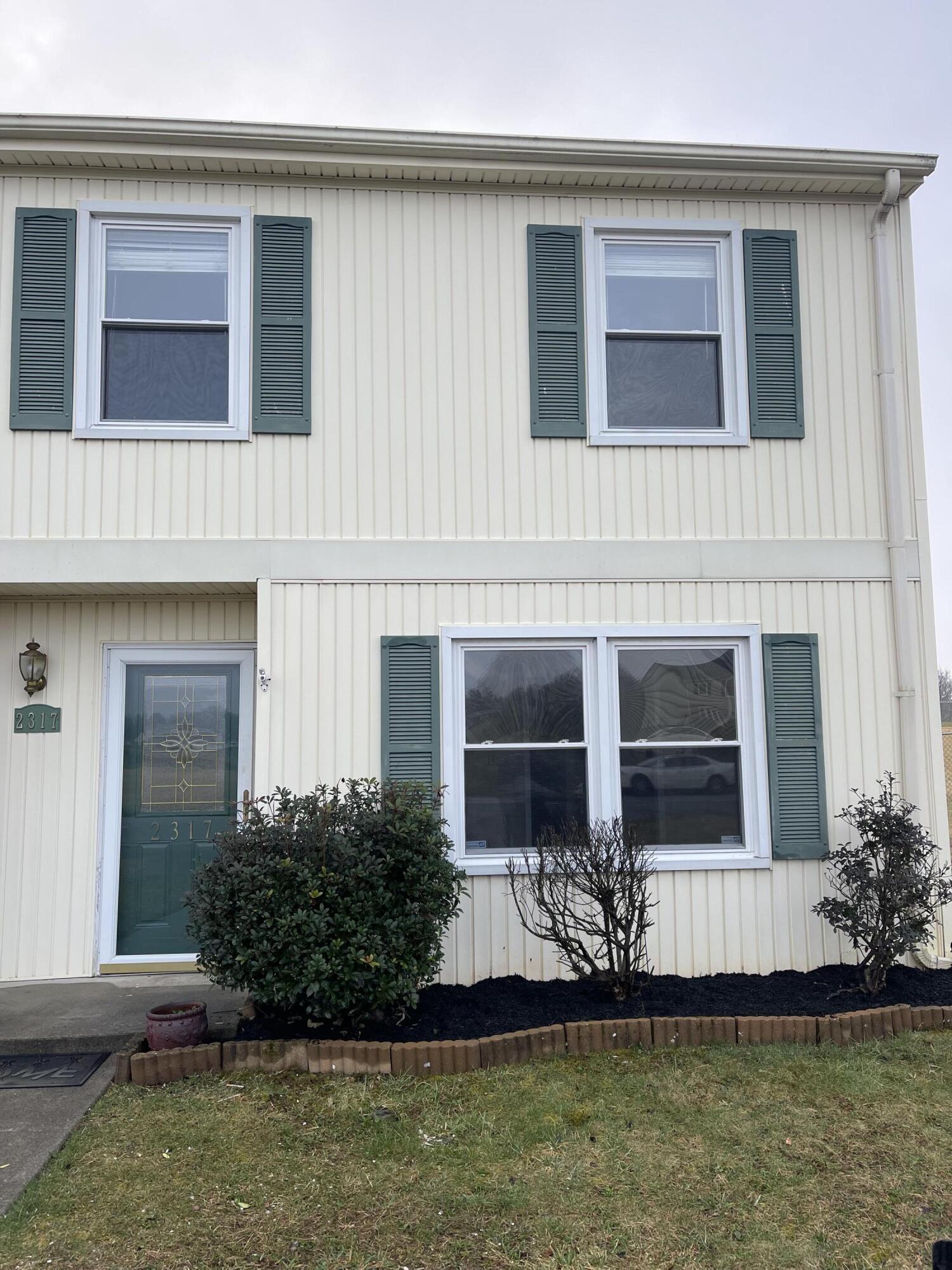 2317 Ranch Road Northwest Roanoke, VA 24017 - Photo 1 of 10 a front view of a house with a yard and garage