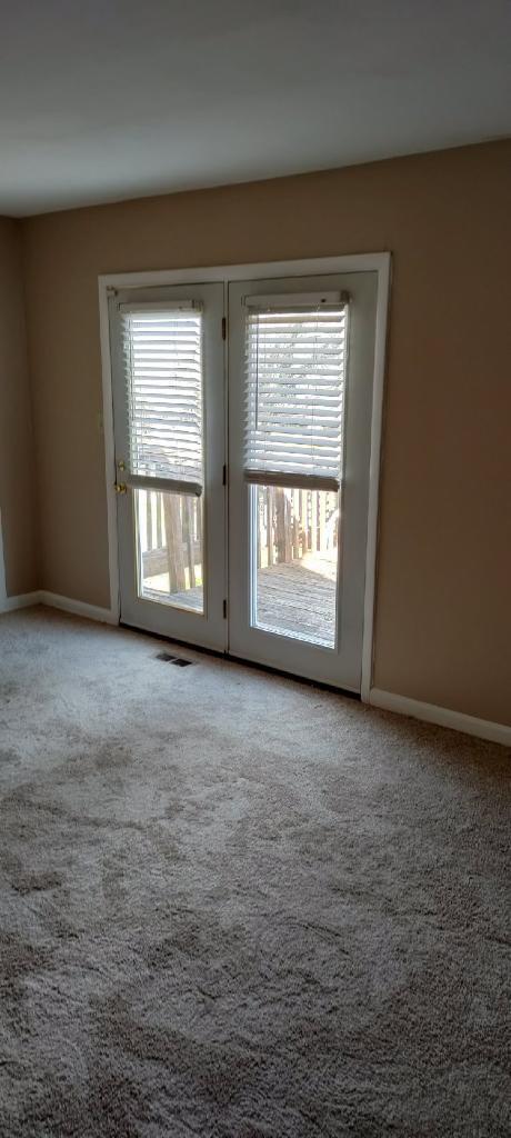 2317 Ranch Road Northwest Roanoke, VA 24017 - Photo 5 of 10 an empty room with a window