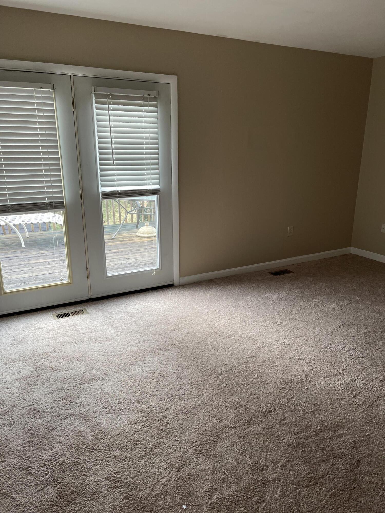 2317 Ranch Road Northwest Roanoke, VA 24017 - Photo 9 of 10 an empty room with a fireplace