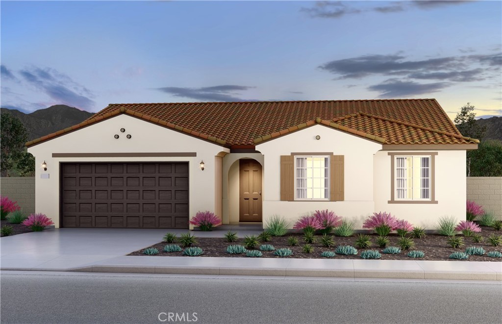 12924 Yountville Court Riverside, CA 92503 - Photo 1 of 1 a front view of a house with a yard and garage