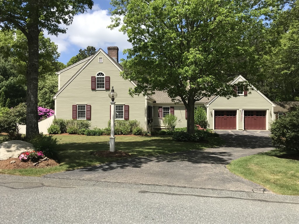 a view of a yard in front view of a house