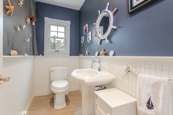 61 Whitmar Road Barnstable, MA 02635 - Photo 12 of 25 a bathroom with a toilet sink and mirror