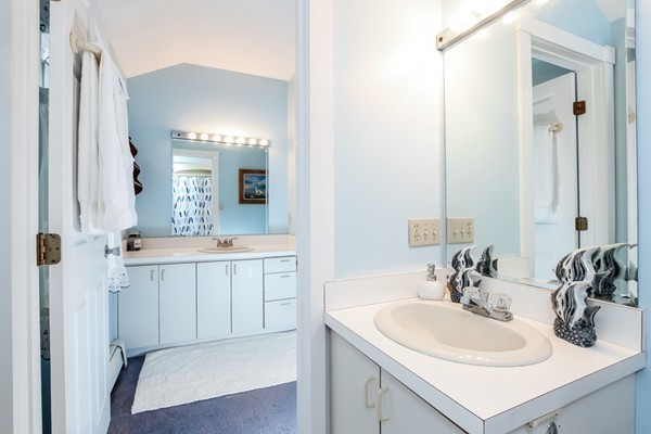 61 Whitmar Road Barnstable, MA 02635 - Photo 17 of 25 a bathroom with a sink and a mirror