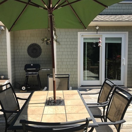 61 Whitmar Road Barnstable, MA 02635 - Photo 24 of 25 a living room with a couch and a table