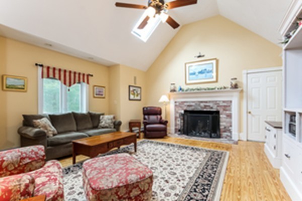 61 Whitmar Road Barnstable, MA 02635 - Photo 3 of 25 a living room with furniture and a fireplace