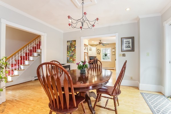 61 Whitmar Road Barnstable, MA 02635 - Photo 6 of 25 a view of a dining room with furniture a chandelier and wooden floor