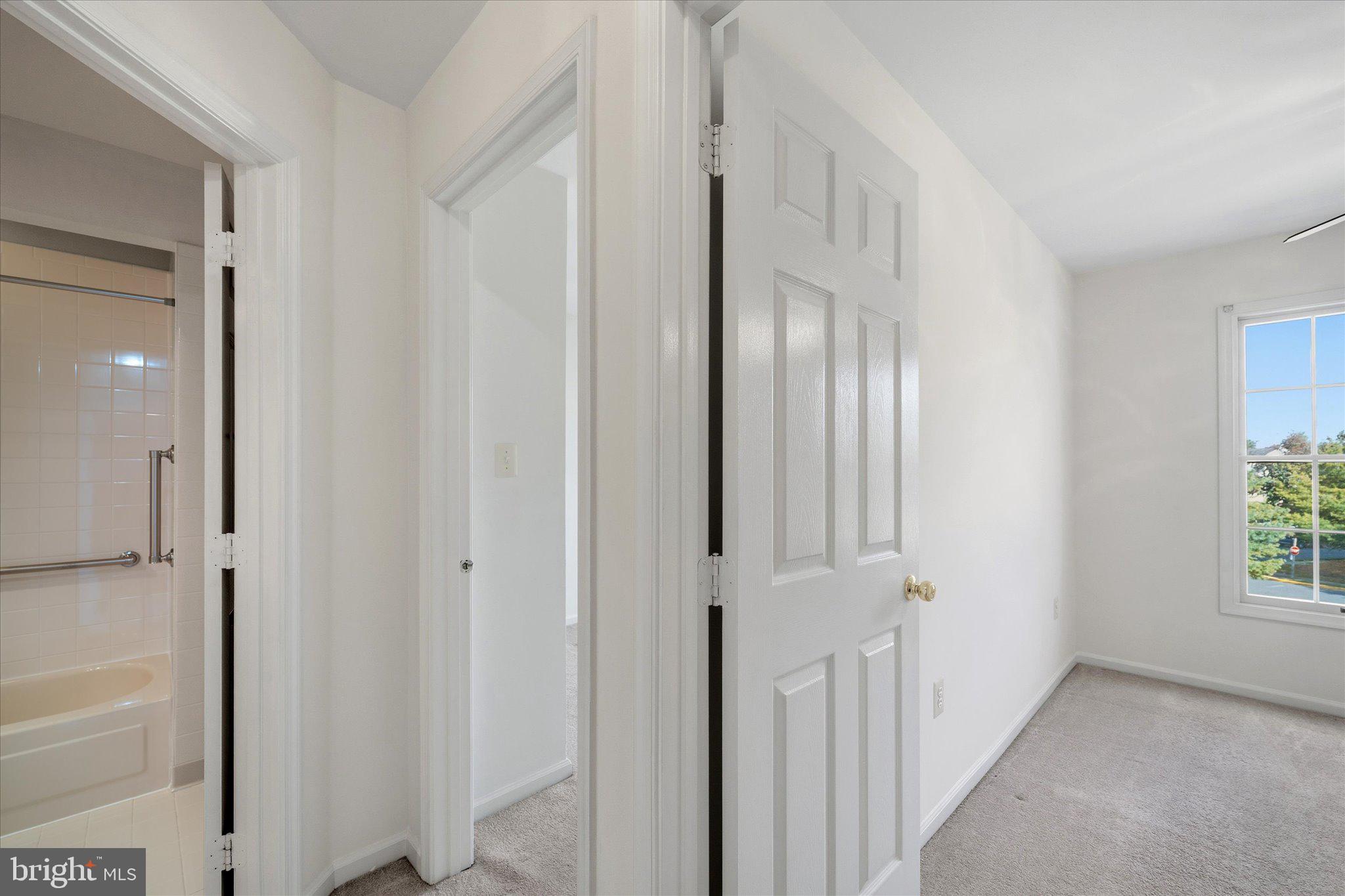 7849 Sabre Court Manassas, VA 20109 - Photo 16 of 35 a view of a hallway with windows