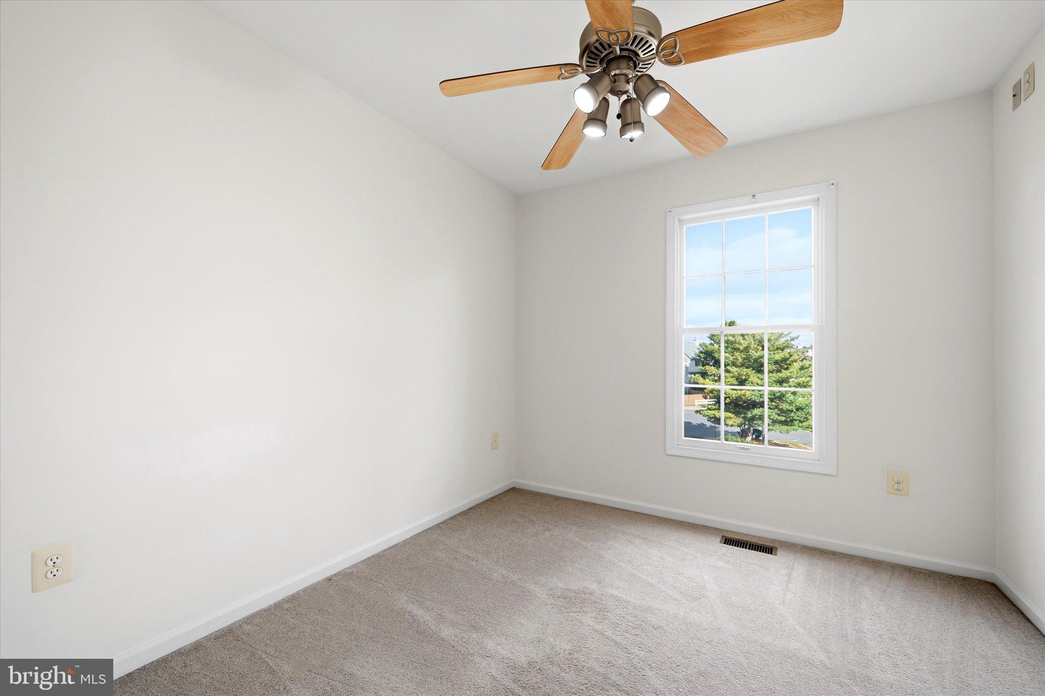 7849 Sabre Court Manassas, VA 20109 - Photo 23 of 35 an empty room with windows and fan