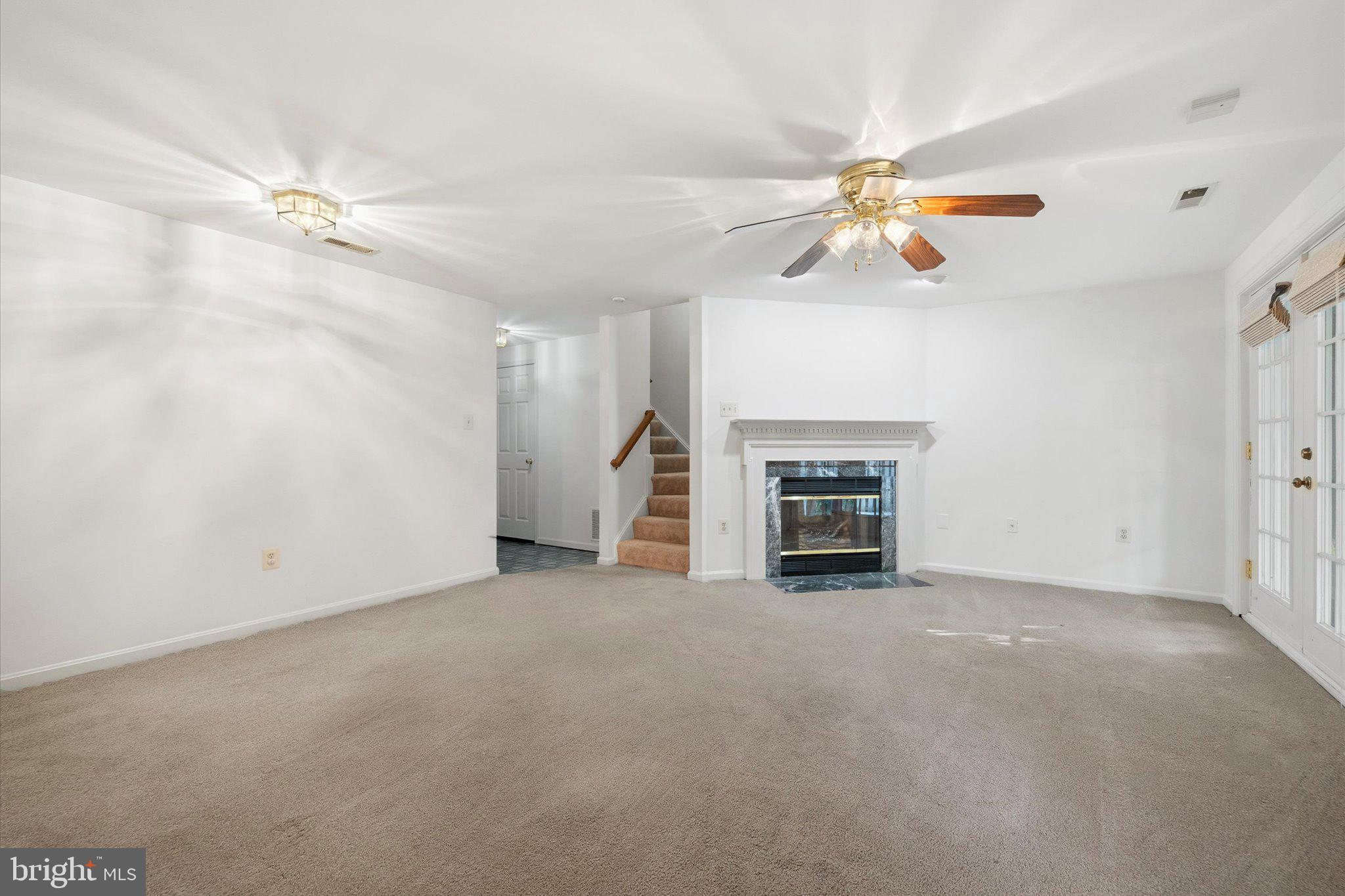 7849 Sabre Court Manassas, VA 20109 - Photo 27 of 35 an empty room with windows and fireplace