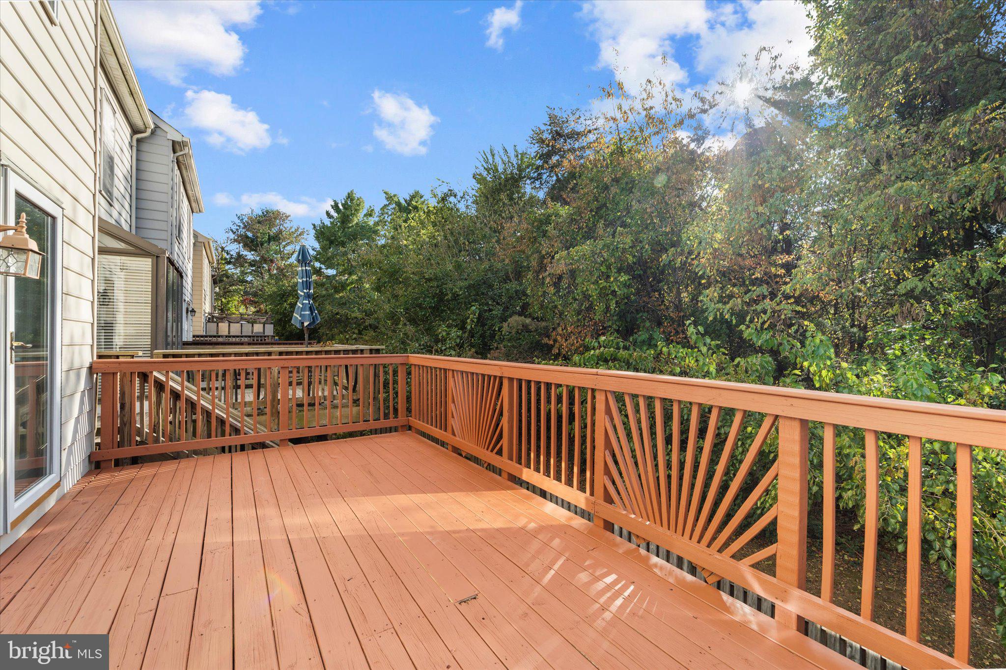 7849 Sabre Court Manassas, VA 20109 - Photo 32 of 35 a view of balcony with wooden floor and fence
