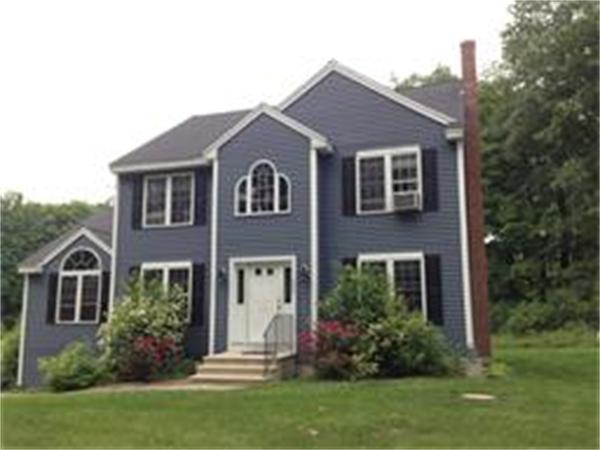 174 Northwest Road Spencer, MA 01562 - Photo 3 of 10 a front view of a house with a yard