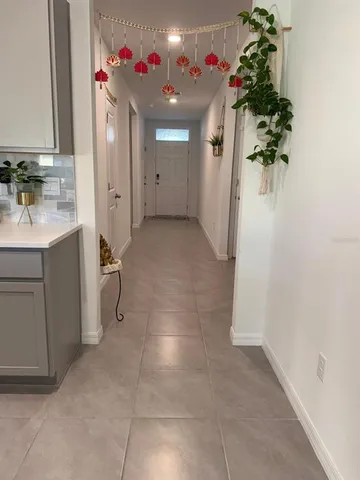 a view of a storage and utility room with a sink