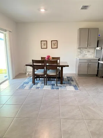 a view of a workspace with furniture