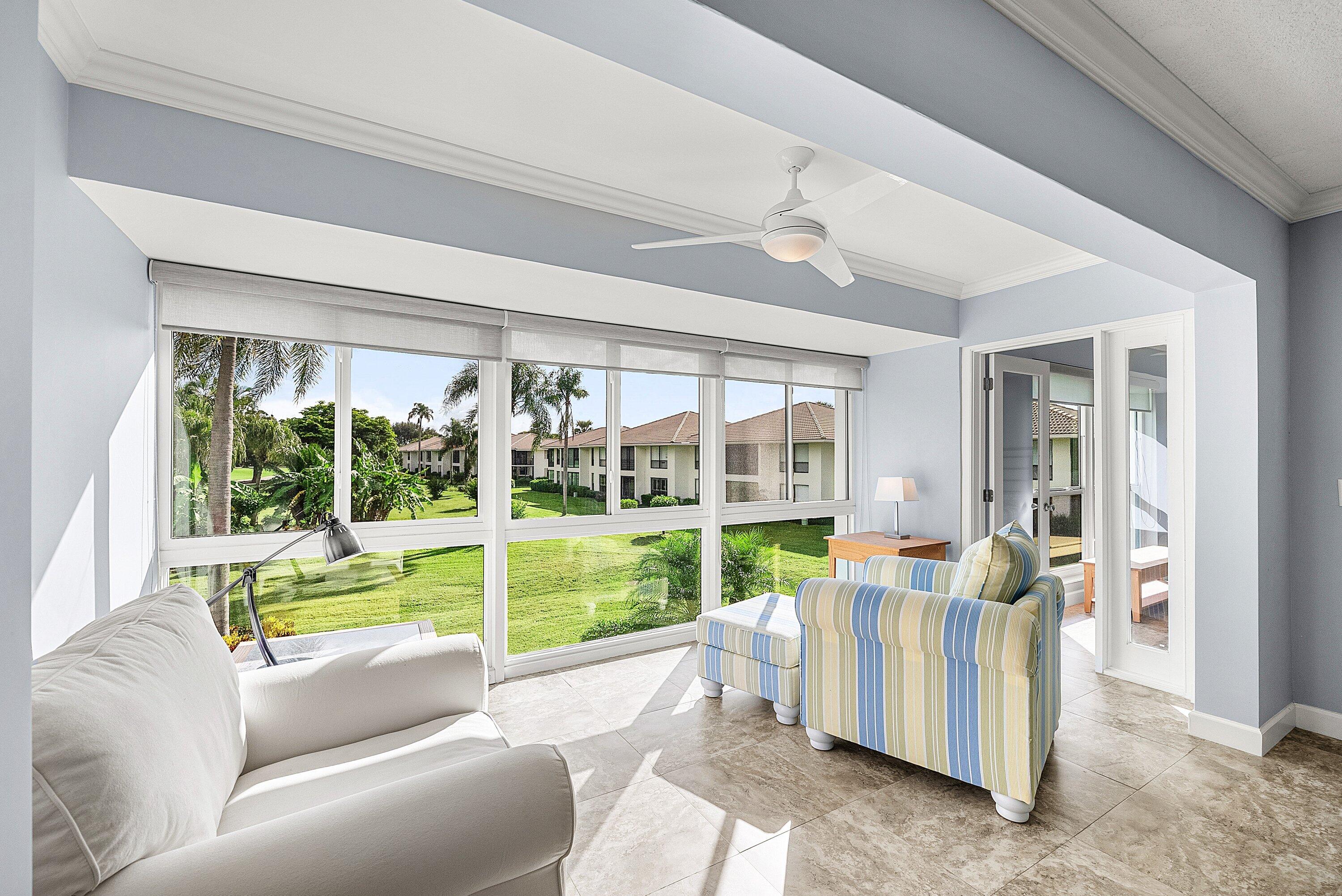 11212 Quail Covey Road, Unit GREEN HERON N Boynton Beach, FL 33436 - Photo 16 of 55 a living room with furniture and a large window