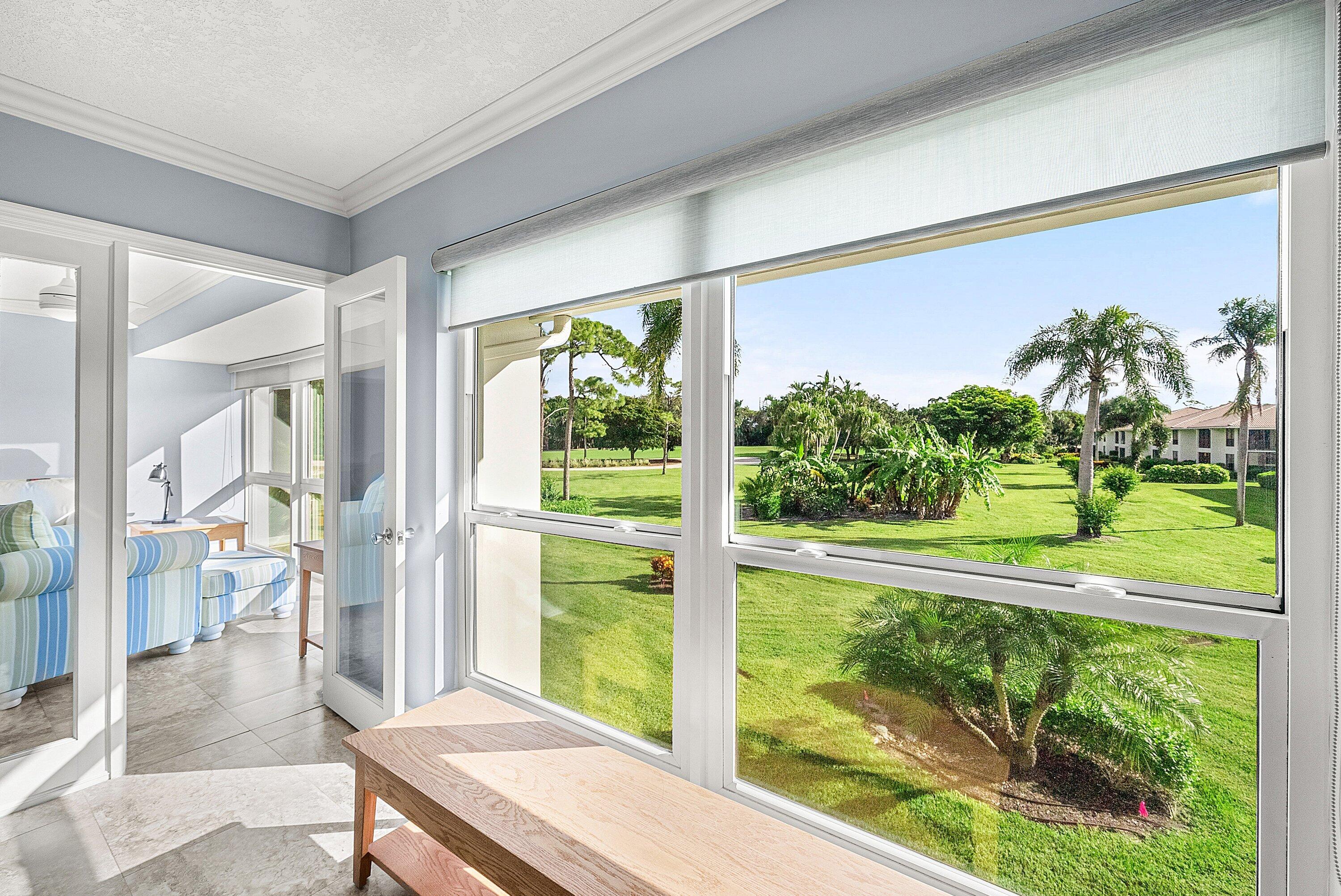 11212 Quail Covey Road, Unit GREEN HERON N Boynton Beach, FL 33436 - Photo 20 of 55 a view of a porch and garden