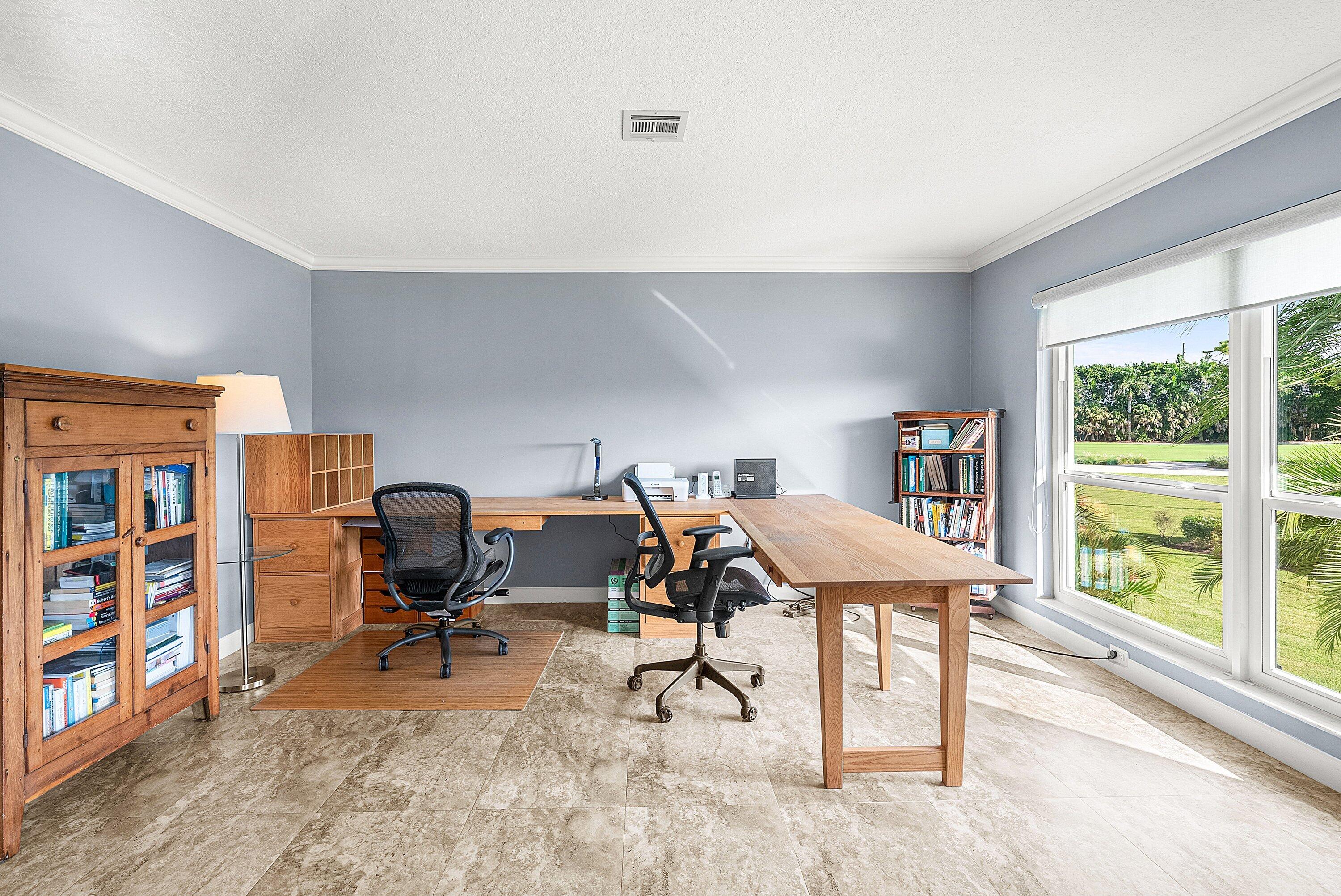 11212 Quail Covey Road, Unit GREEN HERON N Boynton Beach, FL 33436 - Photo 23 of 55 a view of a workspace with furniture and a window