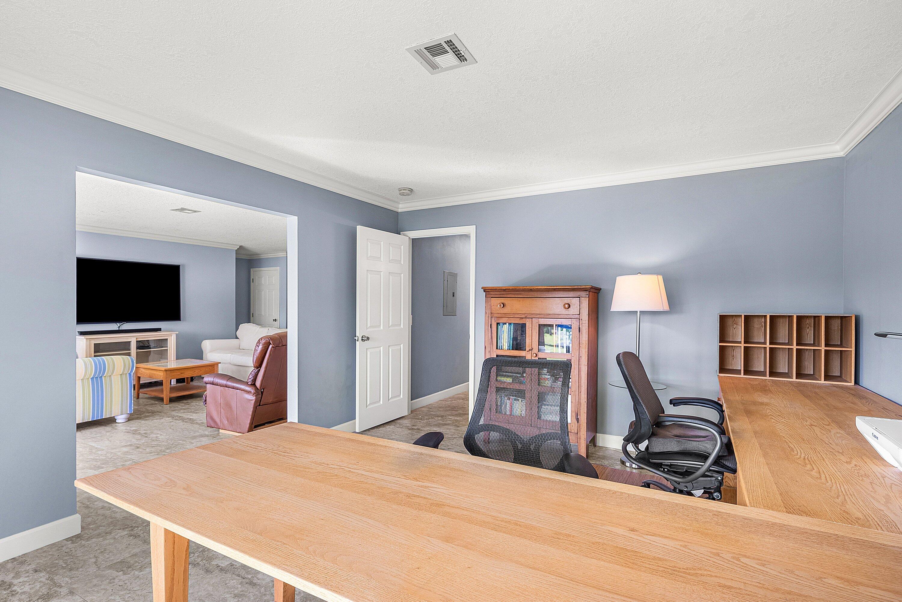 11212 Quail Covey Road, Unit GREEN HERON N Boynton Beach, FL 33436 - Photo 25 of 55 a bedroom with a bed and a flat screen tv