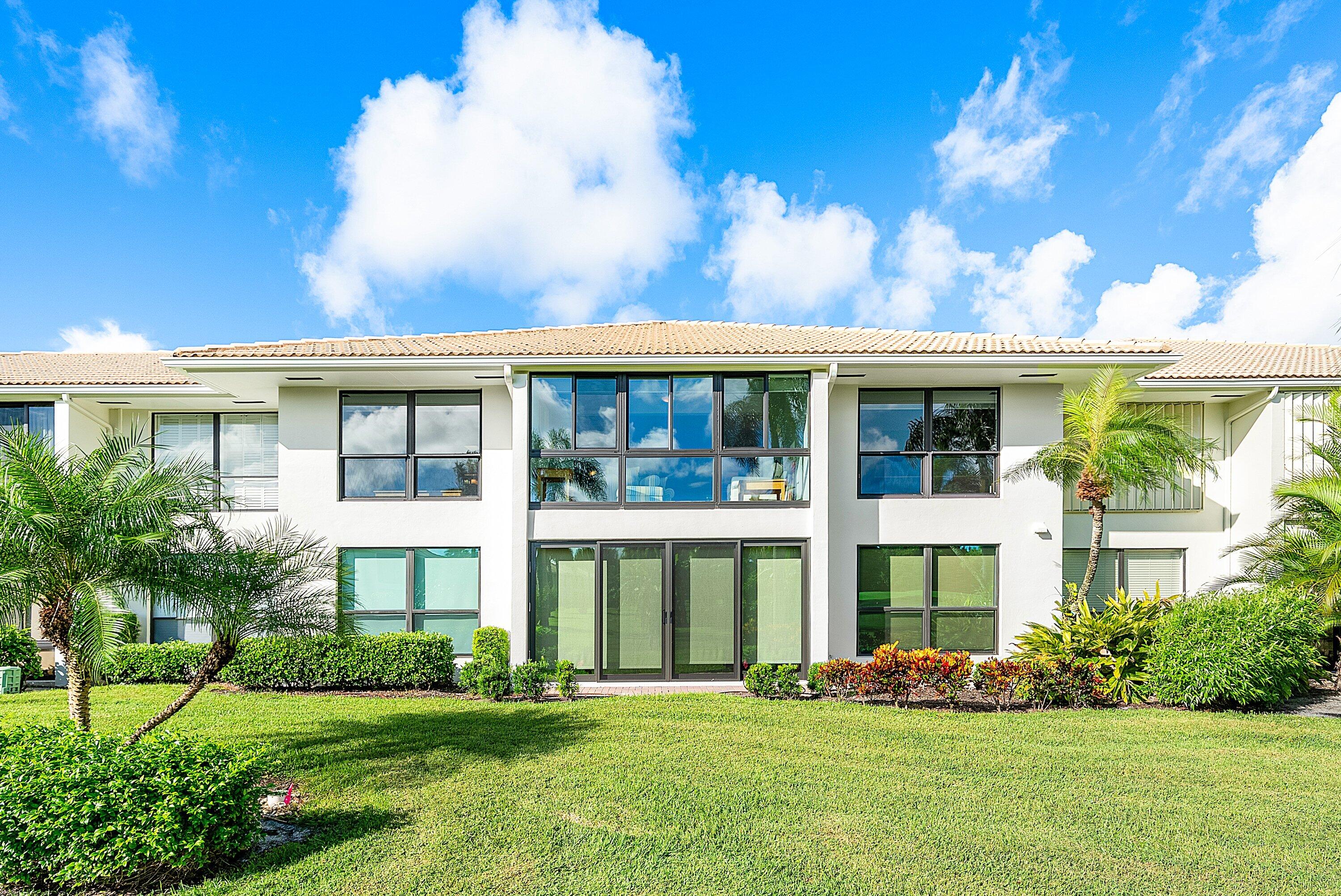 11212 Quail Covey Road, Unit GREEN HERON N Boynton Beach, FL 33436 - Photo 29 of 55 a view of a house with yard and front view of a house