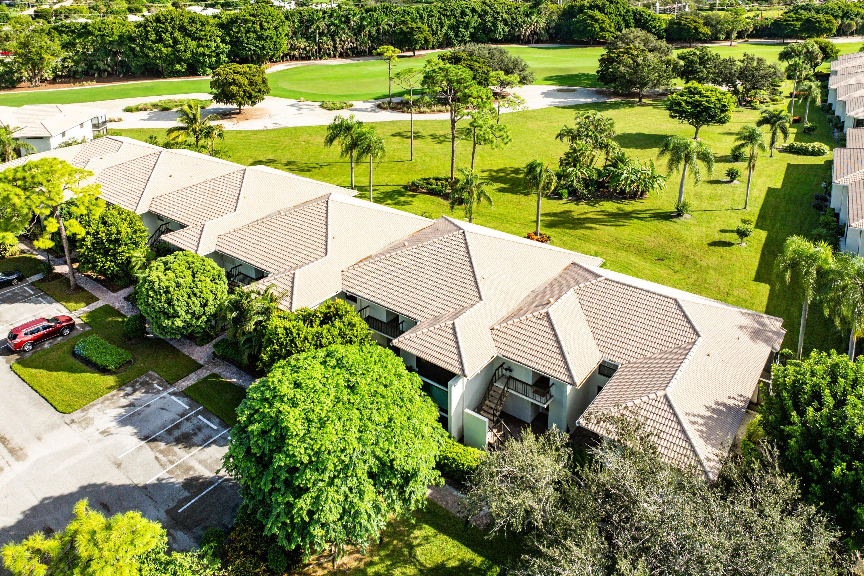 11212 Quail Covey Road, Unit GREEN HERON N Boynton Beach, FL 33436 - Photo 33 of 55 an aerial view of a house with a yard and lake view
