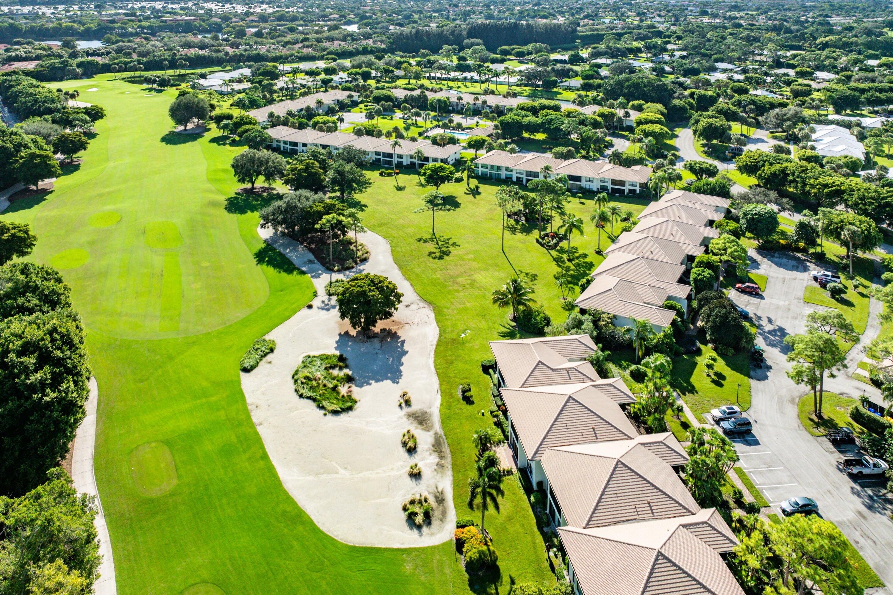 11212 Quail Covey Road, Unit GREEN HERON N Boynton Beach, FL 33436 - Photo 40 of 55 an aerial view of residential houses with outdoor space and swimming pool