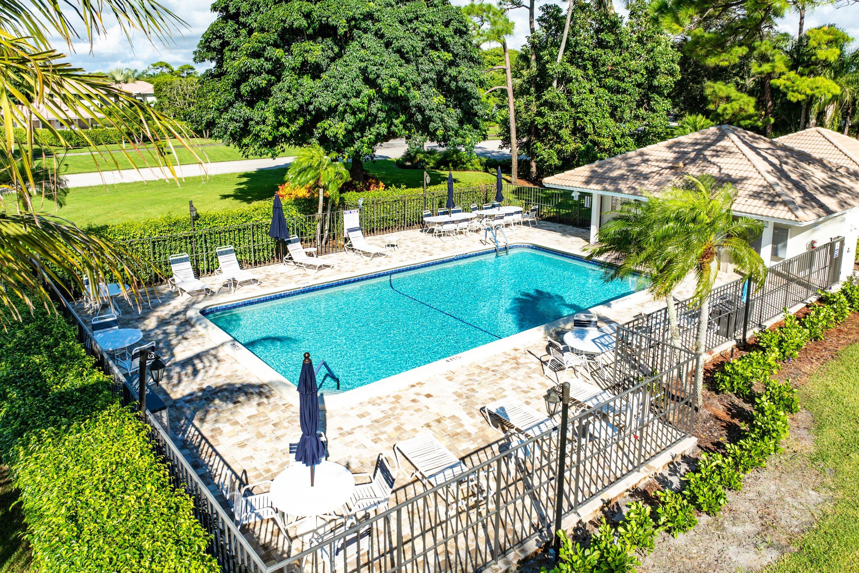 11212 Quail Covey Road, Unit GREEN HERON N Boynton Beach, FL 33436 - Photo 42 of 55 a view of a backyard with sitting area