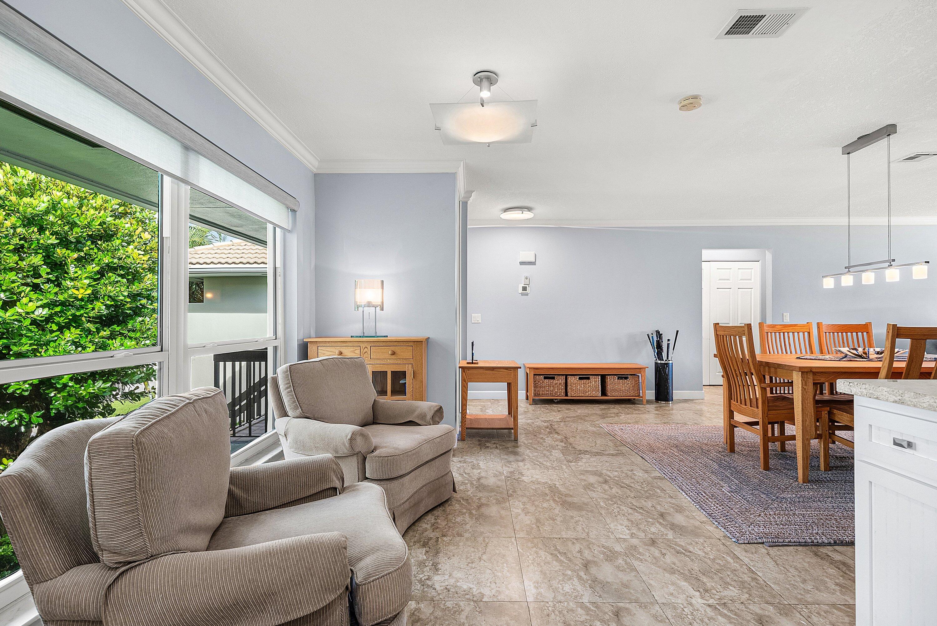 11212 Quail Covey Road, Unit GREEN HERON N Boynton Beach, FL 33436 - Photo 8 of 55 a living room with furniture and a large window