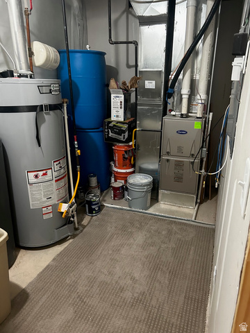 315 South Sherman Street Mapleton, UT 84664 - Photo 22 of 30 Dedicated utility area featuring a water heater, furnace, and essential plumbing infrastructure