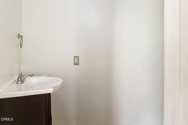a bathroom with a sink and mirror