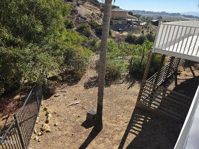 an aerial view of residential house and green space