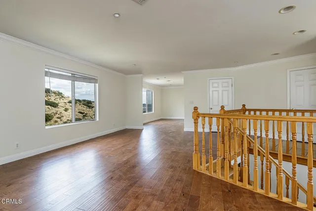 a view of an entryway with wooden floor
