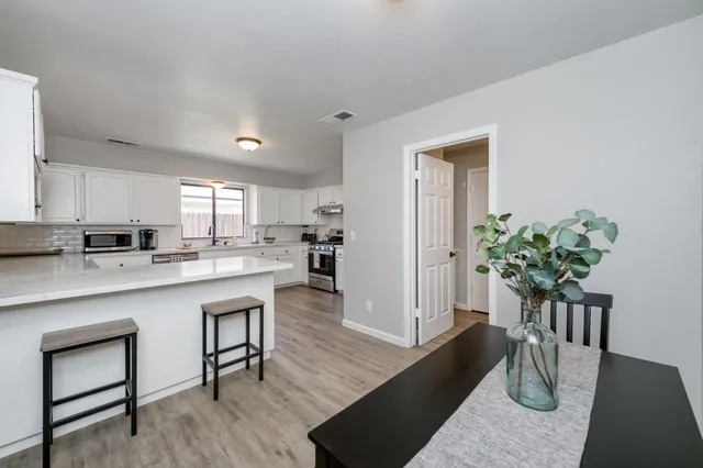 a kitchen with counter top space and cabinets