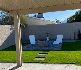 2712 Rialto Road Las Vegas, NV 89108 - Photo 21 of 54 Fenced backyard featuring a patio and an outdoor fire pit